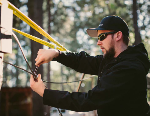 person setting up a zipline