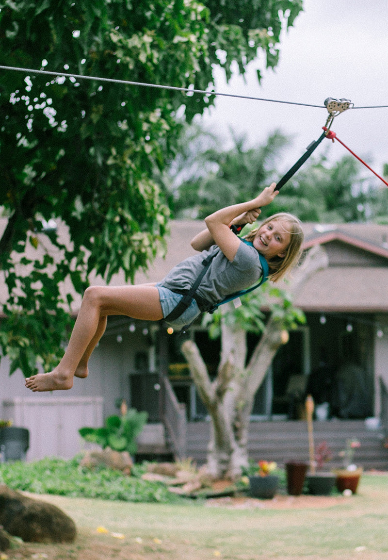 Person using a zip line